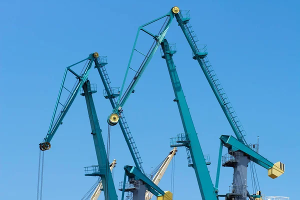 Cranes in industrial dockyard. Cargo terminal in sea port. — Stock Photo, Image