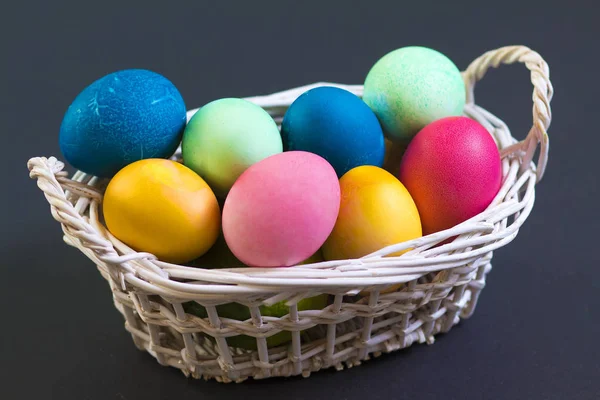 Multi colored Easter eggs in basket