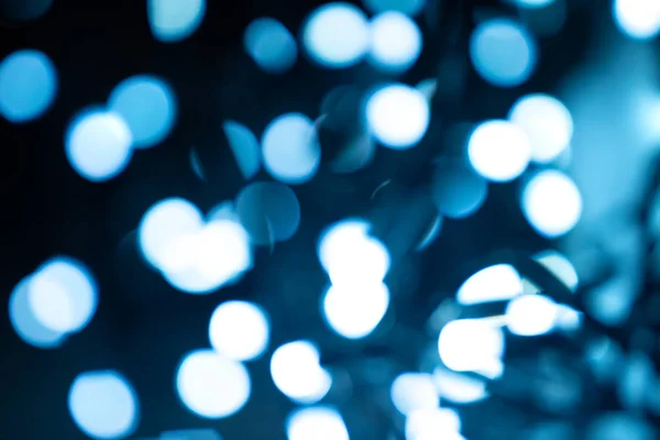 Abstracte wazig lights bokeh op donker blauwe achtergrond. — Stockfoto