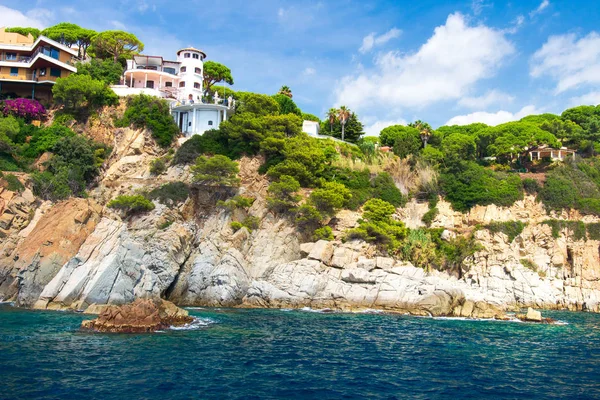 Spanish villa on rocky coast of mediterranean sea in Lloret de M
