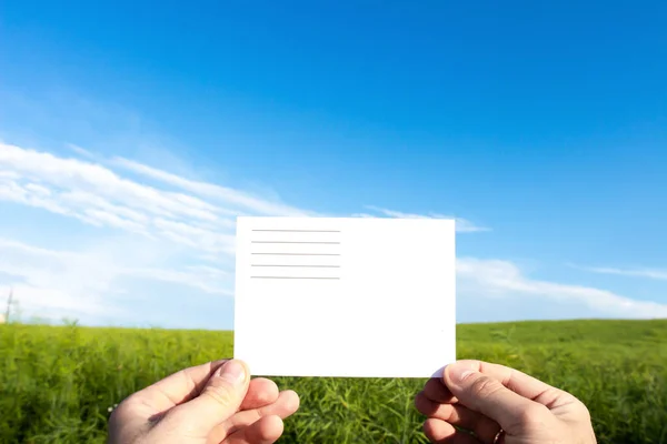 White Envelope Hands Background Green Field Postal Delivery Delivery Letter — Stock Photo, Image