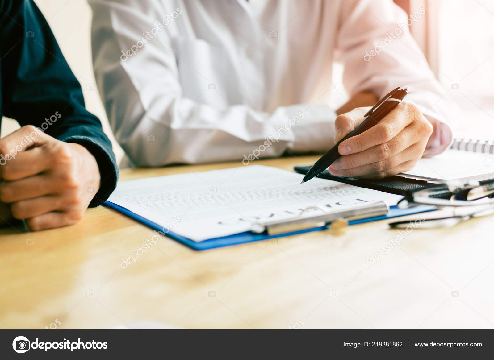 Man Signing Contract Financial Advisor Desk Stock Photo