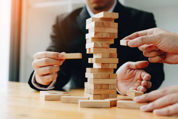 Two Businessmen Help Hold Wood Block Fall — Stock Photo, Image