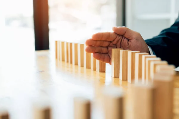 Risk concept with hand of businessman stopping and protection th — Stock Photo, Image