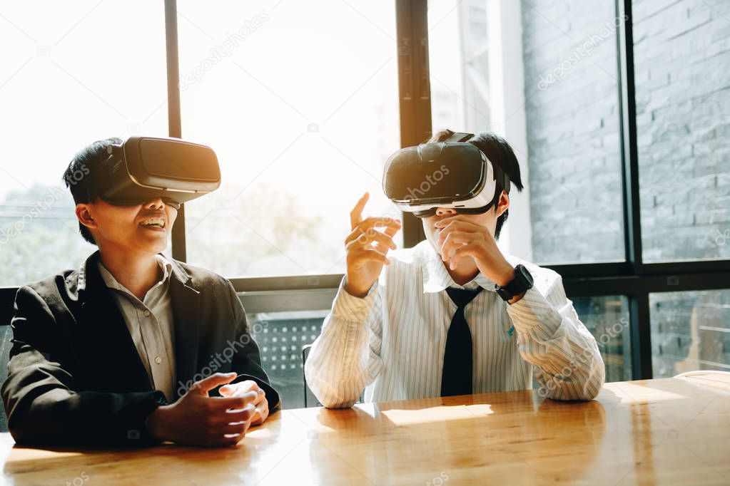 Two business business persons with virtual reality headsets in t
