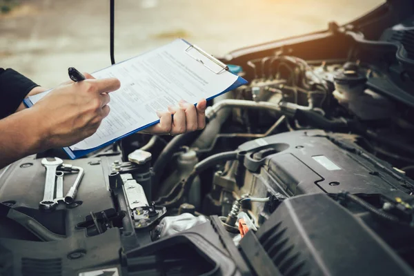 Car mechanic repairing vehicle engine working job. — Stock Photo, Image