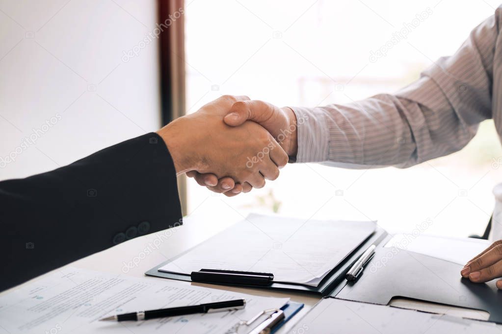 Manager and employee interview concept with handshake after talk