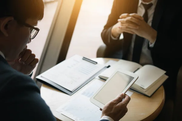 Business partnership coworkers using a tablet to chart company f — Stock Photo, Image