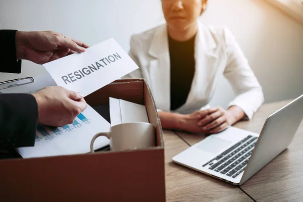 Male employee takes the handle to the resignation envelope while — Stock Photo, Image