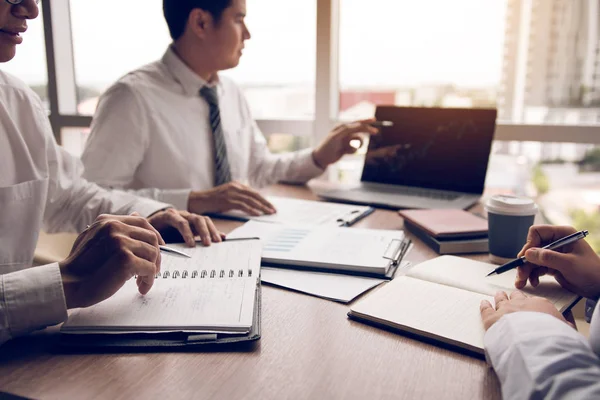 Businessman point to the laptop looking graph of the company fin — Stock Photo, Image