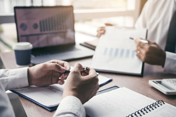 Businessmen explain about quarterly results with colleagues and — Stock Photo, Image