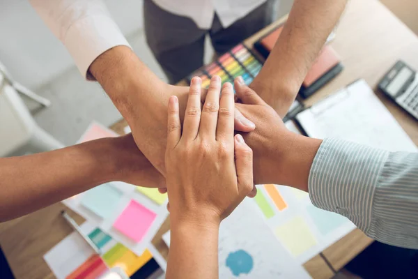 Close up of group of business people joining their hands togethe — Stock Photo, Image