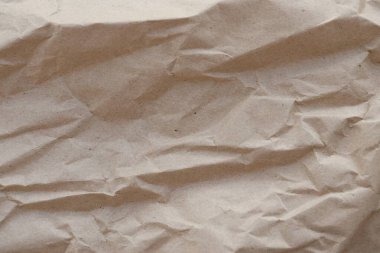 Kahverengi buruşmuş geri dönüşümlü kağıt doku arka planı. Kahverengi buruşmuş geri dönüşümlü karton yaprağın Kraft Kağıt dokusu arka planı