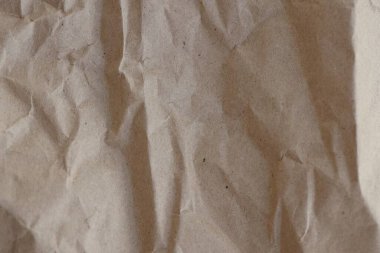 Kahverengi buruşmuş geri dönüşümlü kağıt doku arka planı. Kahverengi buruşmuş geri dönüşümlü karton yaprağın Kraft Kağıt dokusu arka planı