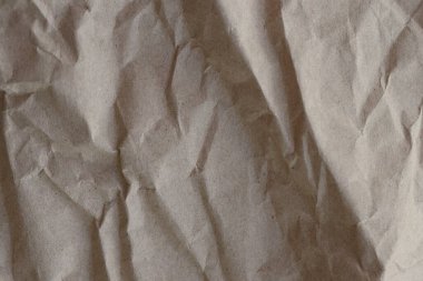 Kahverengi buruşmuş geri dönüşümlü kağıt doku arka planı. Kahverengi buruşmuş geri dönüşümlü karton yaprağın Kraft Kağıt dokusu arka planı