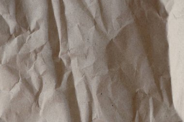 Kahverengi buruşmuş geri dönüşümlü kağıt doku arka planı. Kahverengi buruşmuş geri dönüşümlü karton yaprağın Kraft Kağıt dokusu arka planı