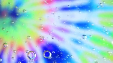 Yağ ve su kabarcıkları bir groovy pembe mavi ve yeşil arka plan üzerinde düzensiz girdap