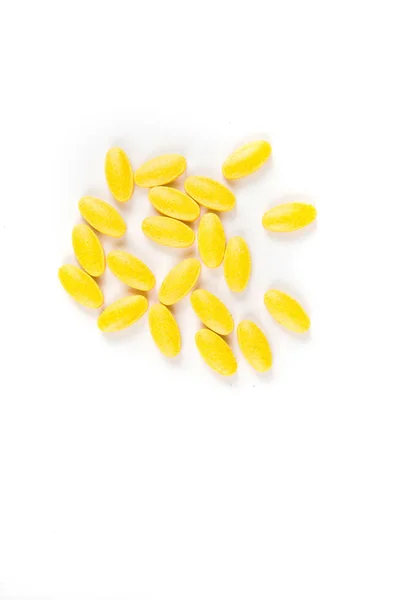 Scattered Yellow Pills White Background — Stock Photo, Image