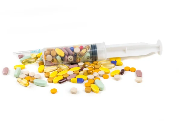 Multicolored Pills Large Syringe Royalty Free Stock Images