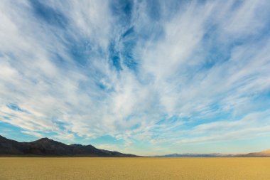 Black Rock playa desert at sunrise with a beautiful cloudy sky clipart