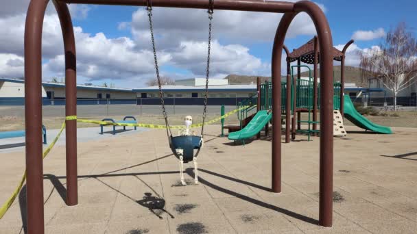 Child Skeleton Front View Swinging Wearing Face Mask School Background — Stock Video