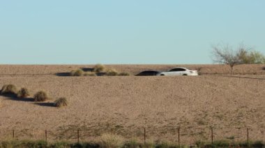 Freeway traffic on a desert highway multiple cars going fast phoenix arizona