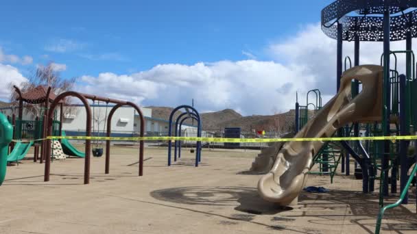 Windy Day Closed Playground Covid Swings Caution Tape Blowing Wildly — Stockvideo