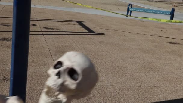 Close Face Adult Skeleton Swinging Slow Motion Empty Closed Park — Αρχείο Βίντεο
