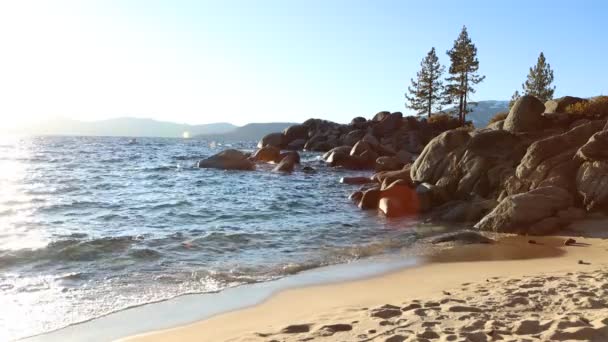 Waves Breaking Empty Beach Sun Flare Sunset Lake Tahoe Nevada — Stockvideo