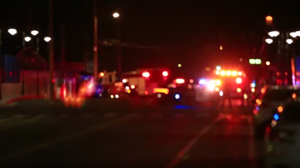 Defocused Scene Lights Flashing Fire Trucks Police Cars People Standing — Stock Video