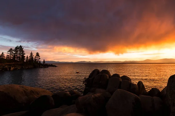 Brilliant Orange Sunset Lake Tahoe Rocks Water Foreground — Stock Photo, Image