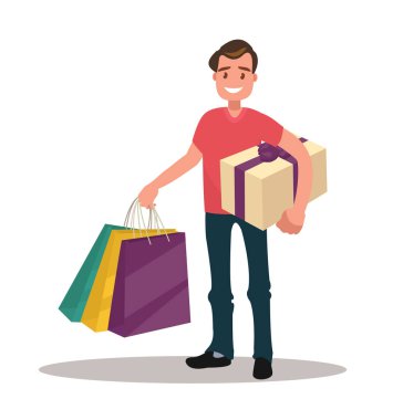 Adam alışveriş. Çanta ve hediye kutusu tutan adam.