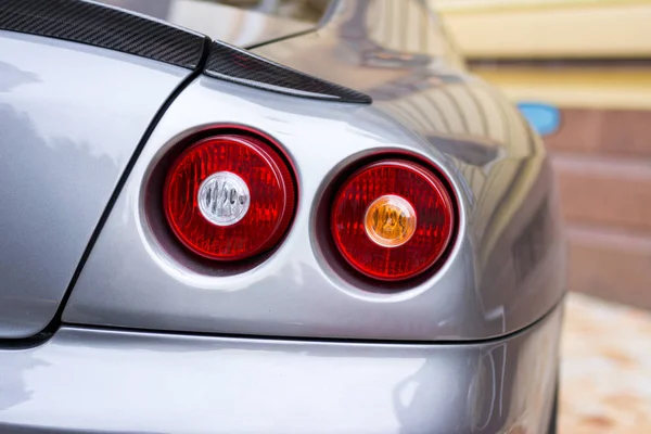Tail lights (rear lights, brake lights) of car close up image