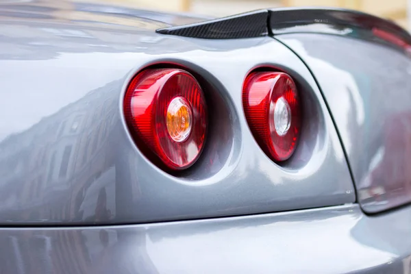 Tail lights (rear lights, brake lights) of car close up image