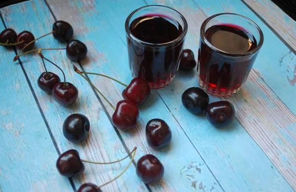 Two Glasses Cherry Liqueur Cherry Blue Background — Stock Photo, Image