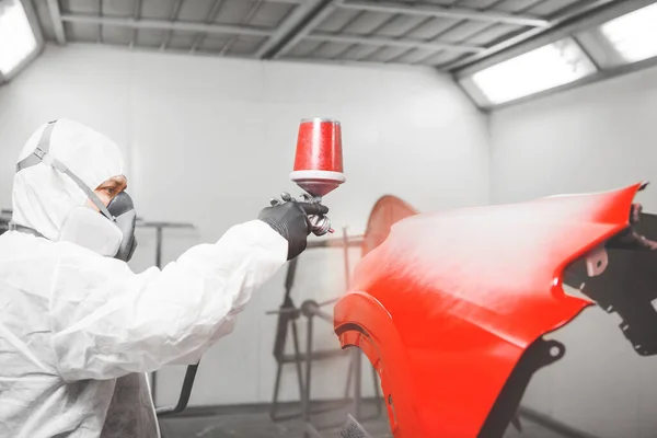 Spraying the paint to the car detail. Paint coating business. — Stock Photo, Image