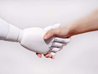 Human hand shakes robot's hand