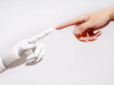 Human and robot fingertips touching