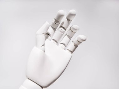 The robot's hand is on a white background