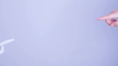 Human and robot fingertips touching