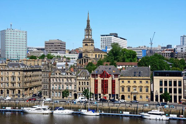 NEWCASTLE, UK  JUNE 11, 2018 - View across the River Tyne towards Newcastle upon Tyne with the church of Saint Willibrord with All Saints clock tower to the centre, Newcastle upon Tyne, Tyne and Wear, England, UK, Western Europe, June 11, 2018.