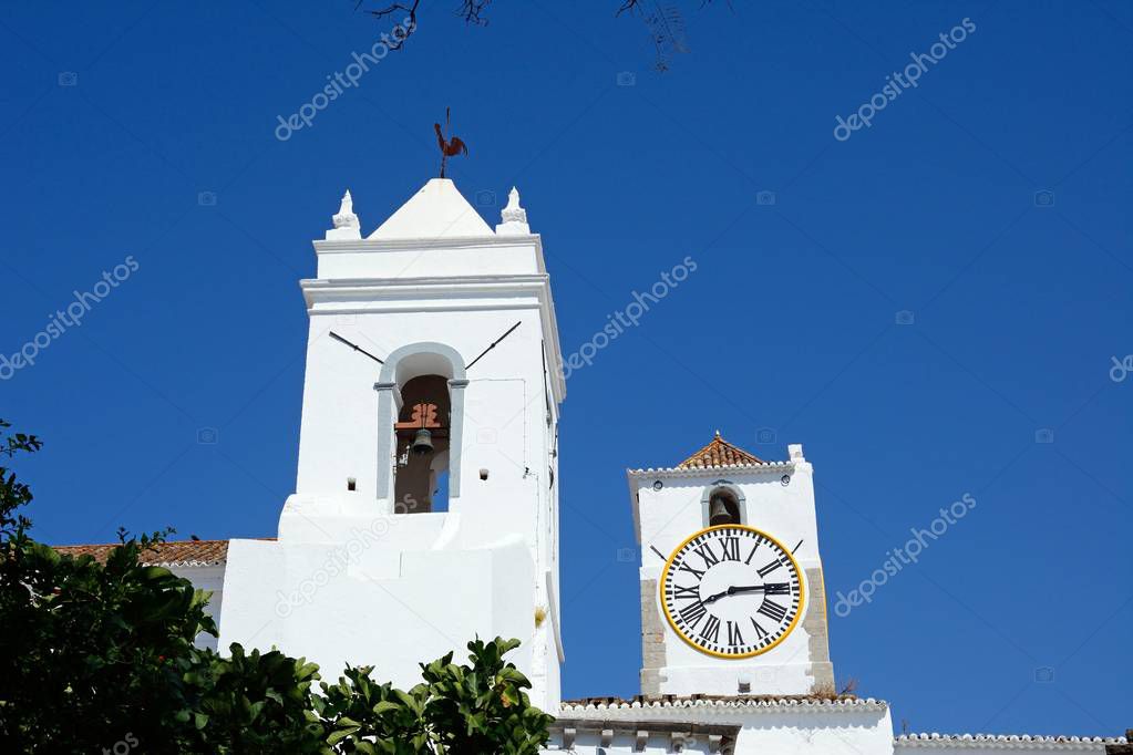 View of St Marys church (Igreja de Santa Maria do Castelo) bell and clock towers, Tavira, Algarve, Portugal, Europe.