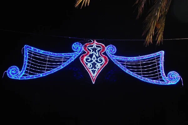 Bright Christmas street lights at night, La Cala de Mijas, Spain.