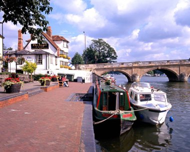 HENLEY-ON-THAMES, UK - AUGUST 02, 1993 - Narrowboat and pleasure cruiser tied to the sidewalk on the River Thames, Henley-on-Thames, Oxfordshire, England, UK, Western Europe, August 2, 1993. clipart