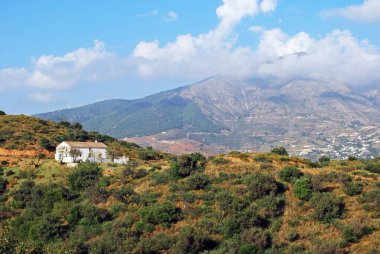 View across countryside towards the Sierra de Mijas mountains with a traditional Spanish finca in the foreground, near Fuengirola, Costa del Sol, Andalusia, Spain, Europe. clipart