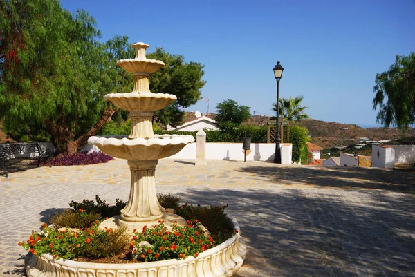 Fountain in a small plaza in the white village (pueblo blanco), Macharaviaya, Costa del Sol, Malaga Province, Andalucia, Spain.