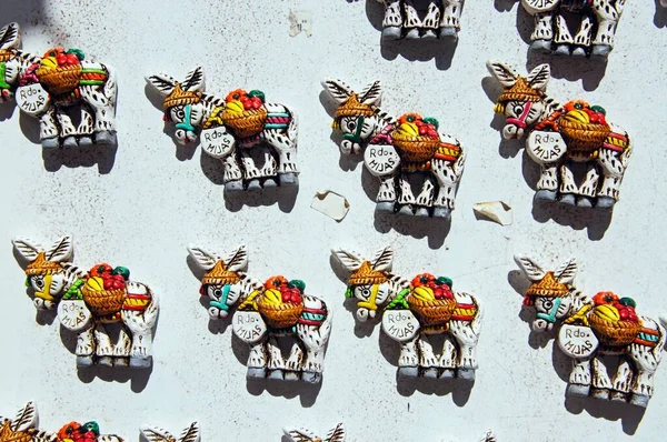 Ceramic magnetic donkeys displayed outside a shop in pueblo blanco (whitewashed village), Mijas, Costa del Sol, Malaga Province, Andalucia, Spain, Europe.