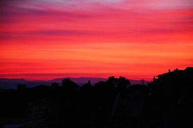 Mediterranean sunset over house rooftops, Costa del Sol, Malaga Province, Andalucia, Spain, Europe. clipart