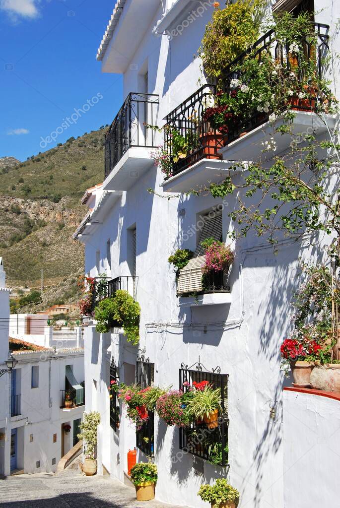 View of Spanish townhouses along a village street, Frigiliana, Malaga Province, Andalucia, Spain, Europe.