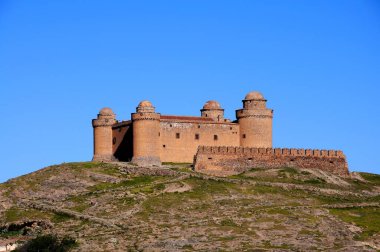 View of the castle on the hilltop, La Calahorra, Granada Province, Andalucia, Spain, Europe. clipart